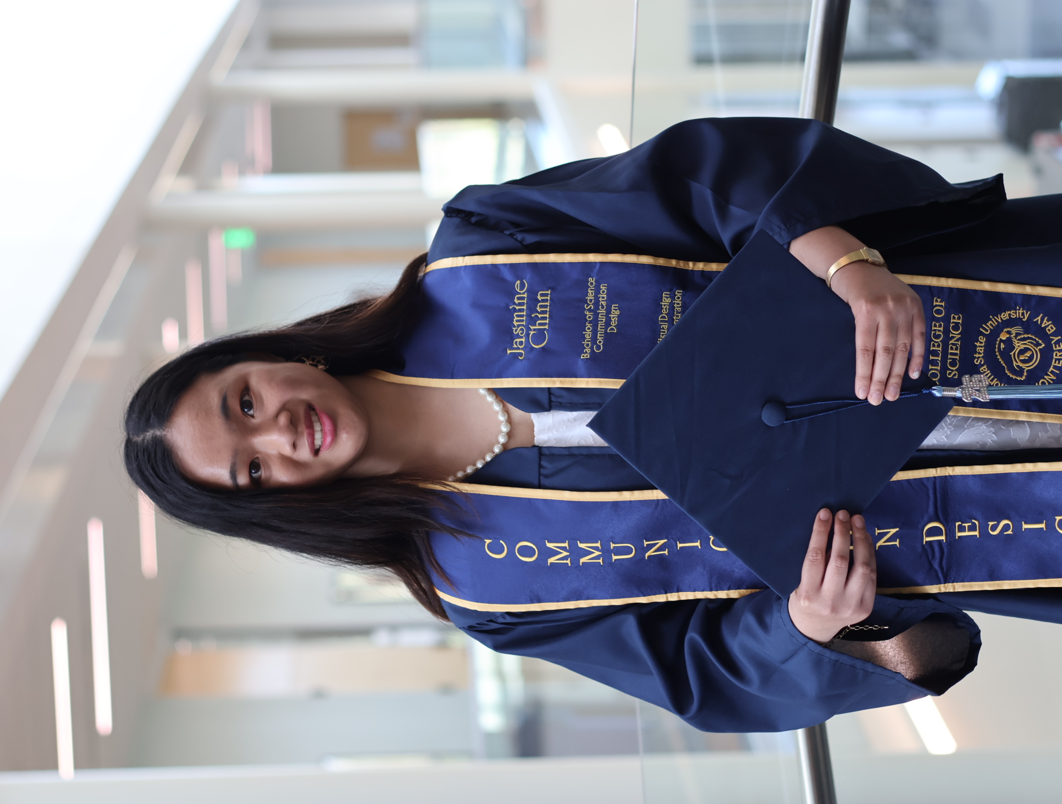 Jasmine Chinn in graduation regalia