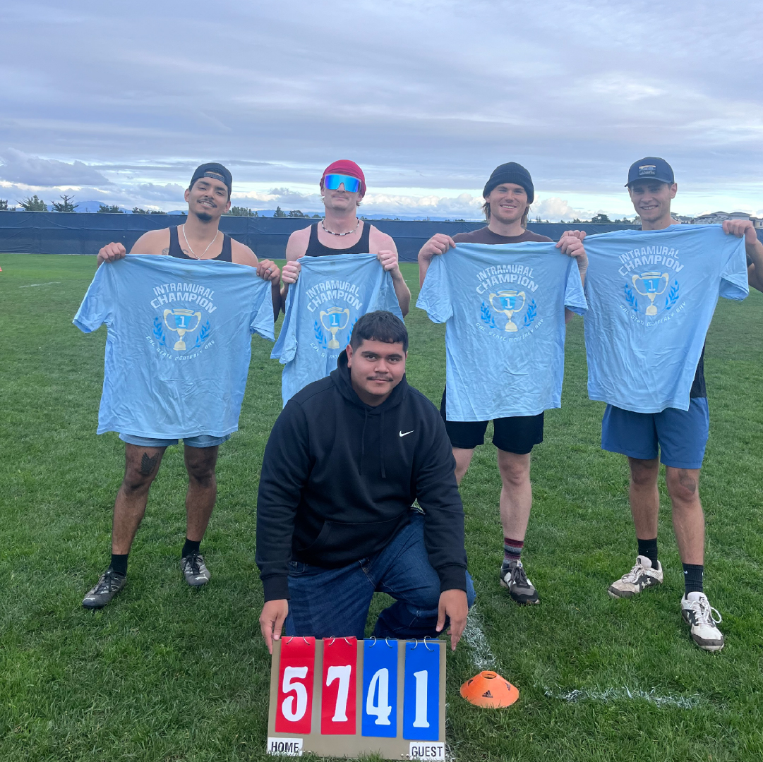 Recreation intramural champions holding T-shirts